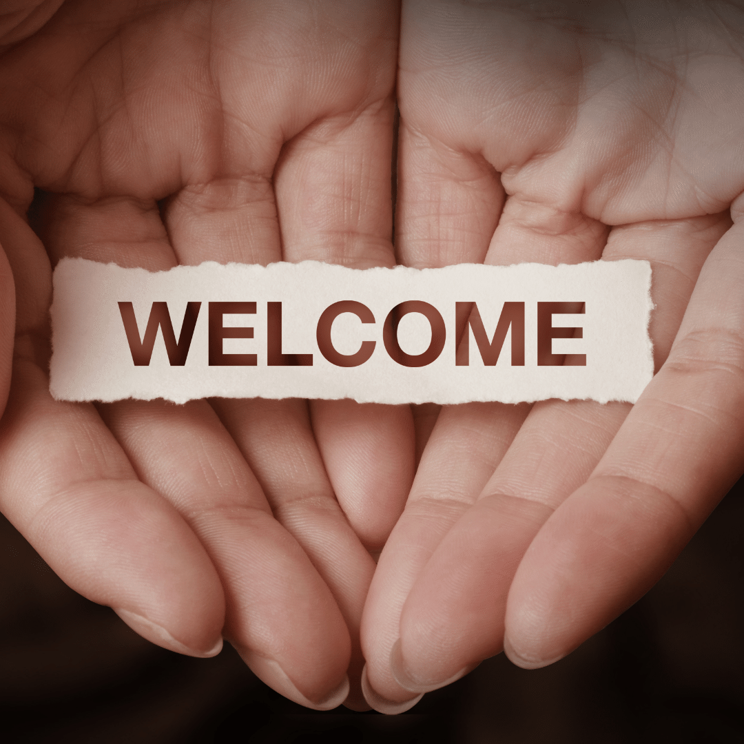 Hands holding WELCOME